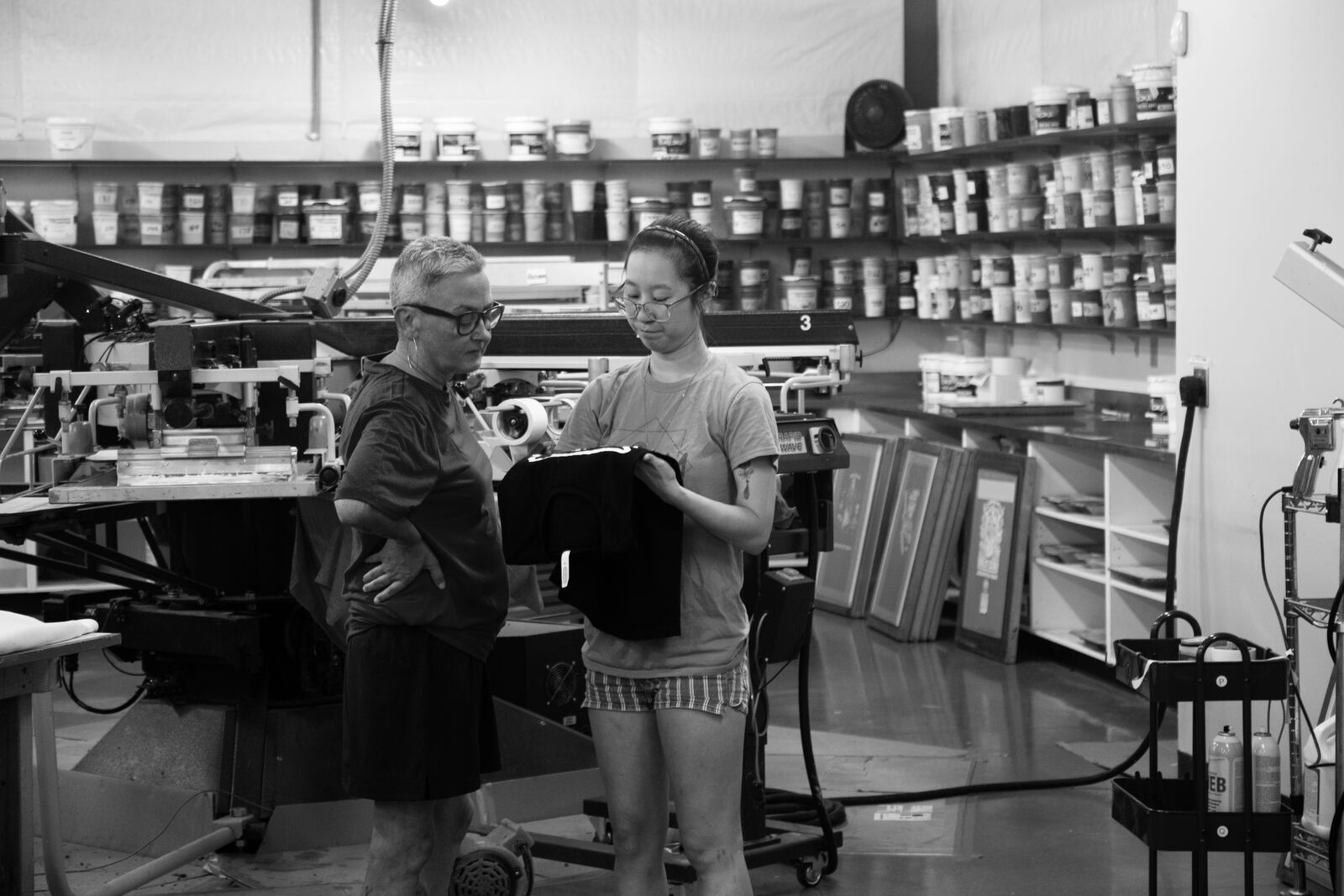 Checking a finished shirt on the production floor
